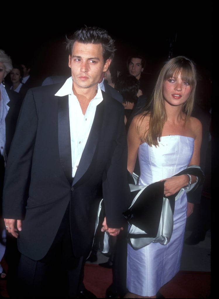 Wearing a white strapless shift dress, with Johnny Depp in 1995.