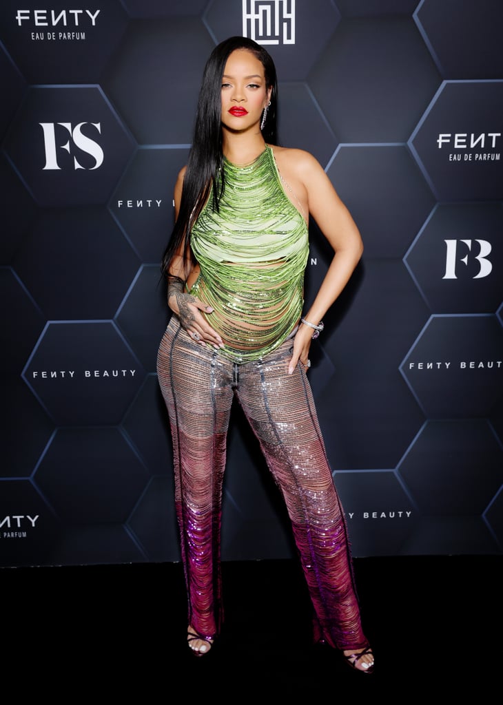 Rihanna has been serving us look after look since her pregnancy announcement with boyfriend A$AP Rocky. Last night might have been the most stunning ensemble of them all as the star arrived at her Fenty Beauty Universe event at Goya Studios in Los Angeles. Rihanna wore an Attico sparkly shredded halter top that bared her baby bump, along with coordinating pink colorblock pants. She completed the outfit with strappy purple heels and diamond encrusted jewelry.
A$AP Rocky was also in attendance to show support for Rihanna, wearing a purple Louis Vuitton letterman jacket. We love how the pair keep casually coordinating with each other. If the past week of looks proves anything, it's that Rihanna is entering another era of iconic style moments we'll be talking about and trying to emulate for years.
Keep reading to see all of the cool details in Rihanna's two-piece pant set.

    Related:

            
            
                                    
                            

            Rihanna Rocks a Y2K-Inspired Crop Top in Yet Another Bump-Revealing Look