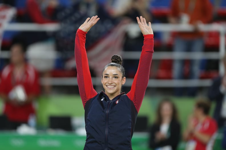 Gymnastics - Olympics: Day 6  Alexandra Raisman #395 of the United States waves to the crowd on the podium before receiving her silver medal during the Artistic Gymnastics Women's Individual All-Around Final at the Rio Olympic Arena on August 11, 2016 in 