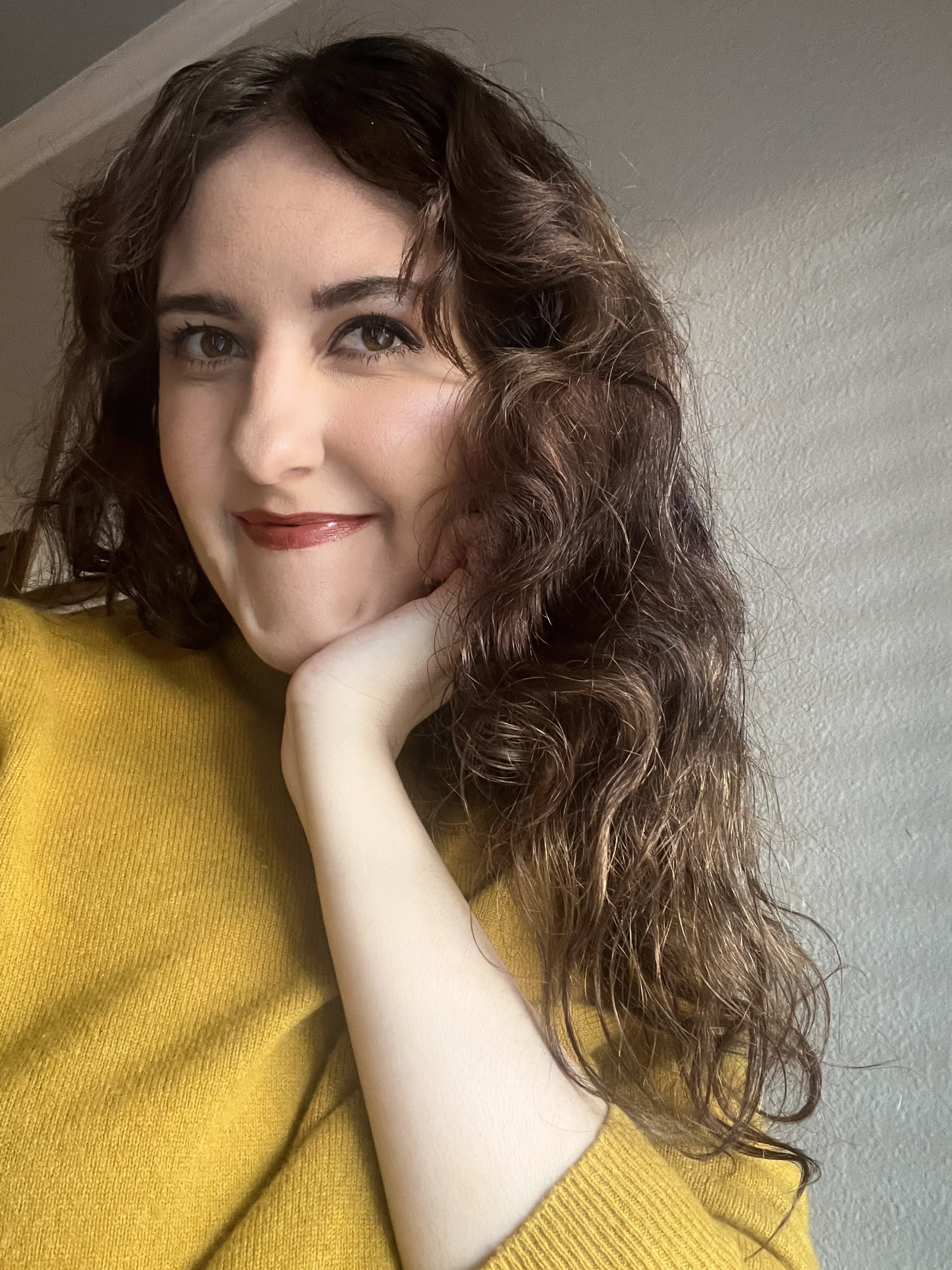 woman uses acure moroccan argan hair oil