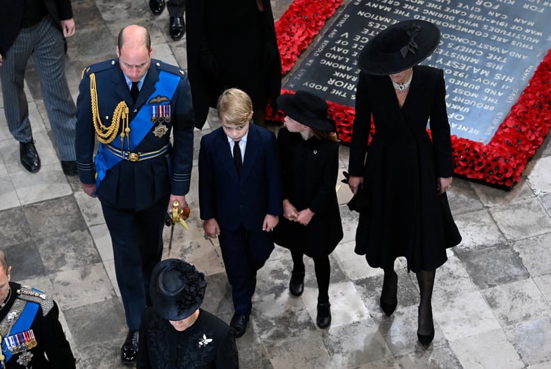 LONDON, ENGLAND - SEPTEMBER 19: Prince William, Prince of Wales, Prince George, Prince of Wales, Princess Charlotte of Wales and Catherine, Princess of Wales depart Westminster Abbey during the State Funeral of Queen Elizabeth II on September 19, 2022 in 
