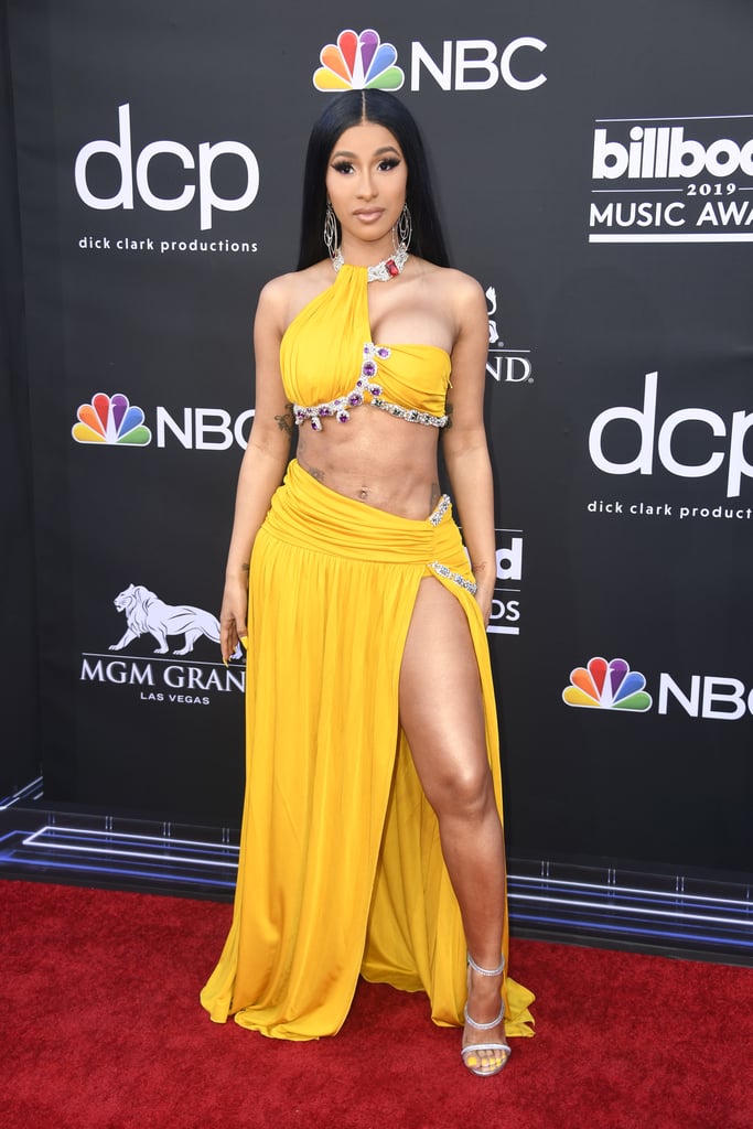 Cardi B's Louis Vuitton ponytail matches her crop top and skirt