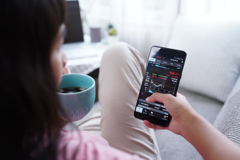 Woman invest online stocks trading on mobile platform app