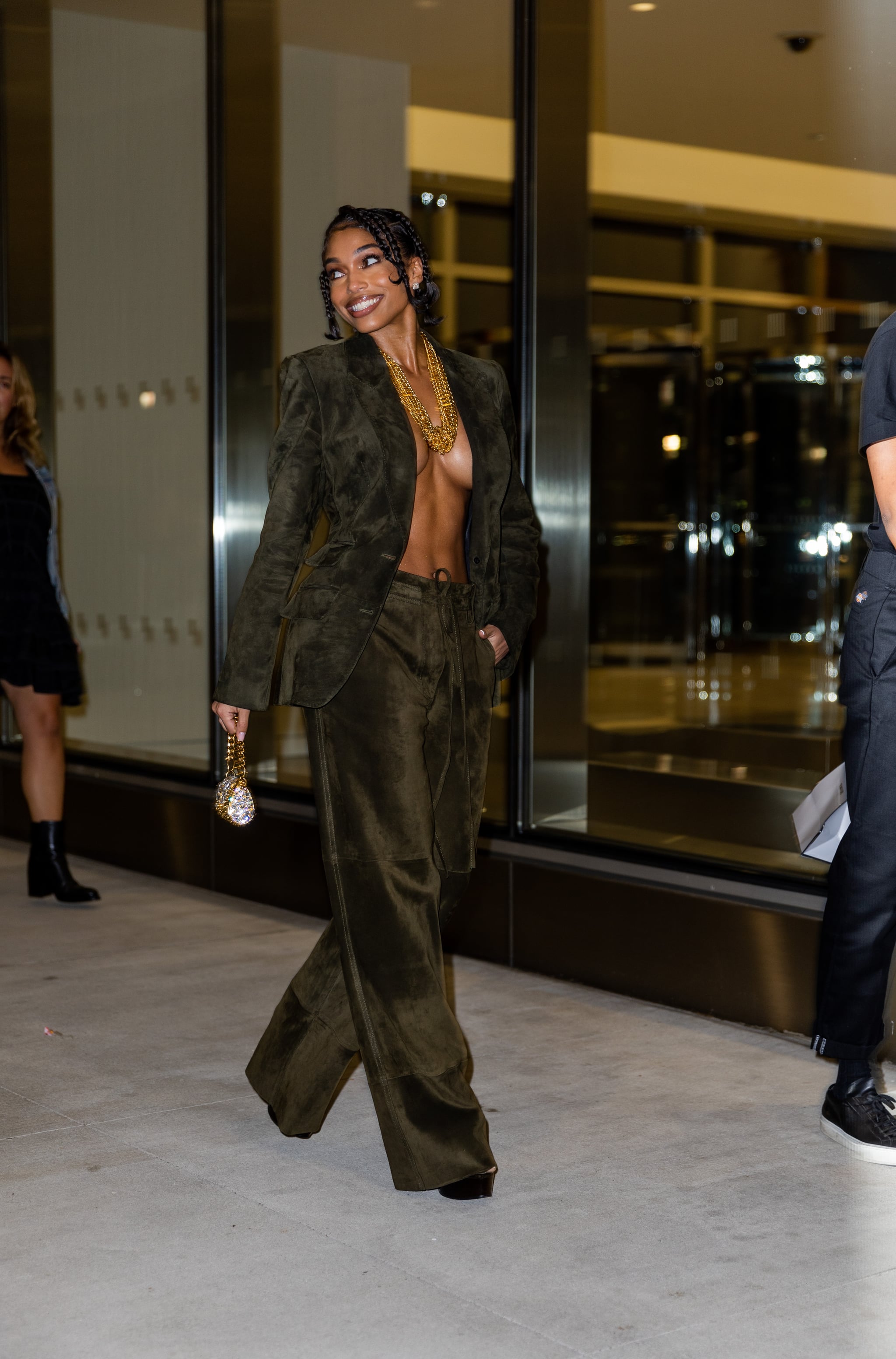 NEW YORK, NEW YORK - SEPTEMBER 14: Lori Harvey wearing khaki blazer and pants, micro bag outside Tom Ford on September 14, 2022 in New York City. (Photo by Christian Vierig/Getty Images)