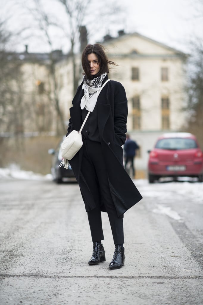 Black and white done right, with a chic bag and a flash of print on her scarf. 
Source: Le 21ème | Adam Katz Sinding