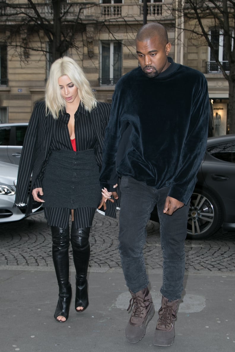 When Kim's ensemble consisted of thigh-high boots and Givenchy pinstripes, but Kanye was still all about that velour pullover.