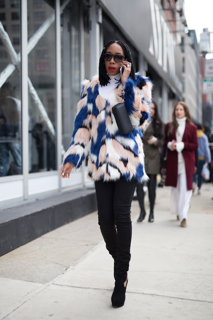 With a Bright Colored Faux-Fur Coat, a Clutch, and Black Booties