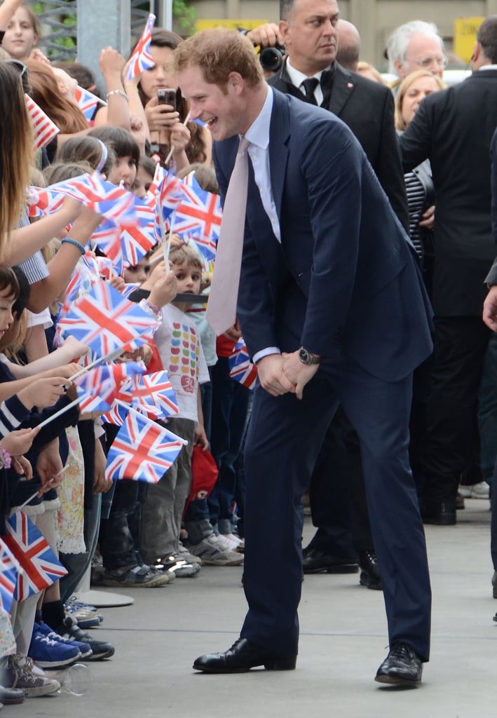 Prince Harry greeted children and signed autographs at the Maxxi Museum in Rome on Sunday.