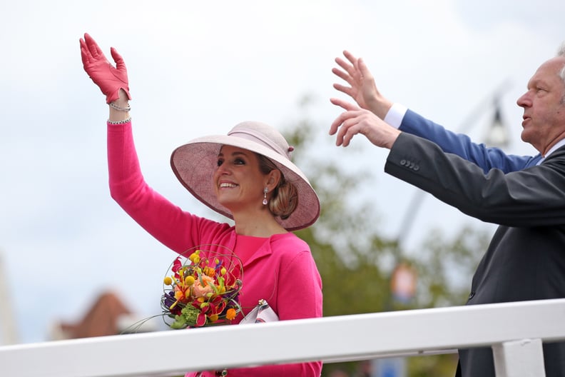 She Matched Her Gloves to Her Sweater and Wore a Lighter-Pink Hat