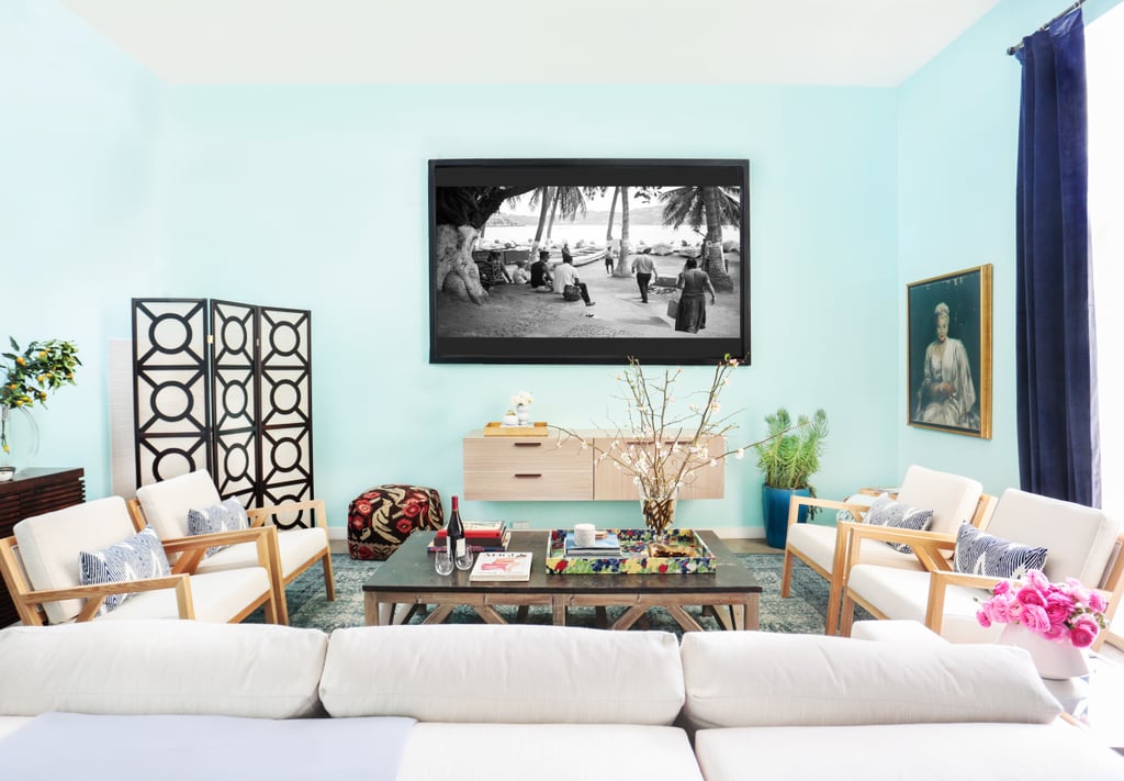 "The chairs and couch are quite simple and chic, a bit more reflective of our lifestyle now," says Whitney of the current furnishings, which are a far cry from the hand-me-down Moroccan-feeling couch and brown leather chair they used to have in the space.
