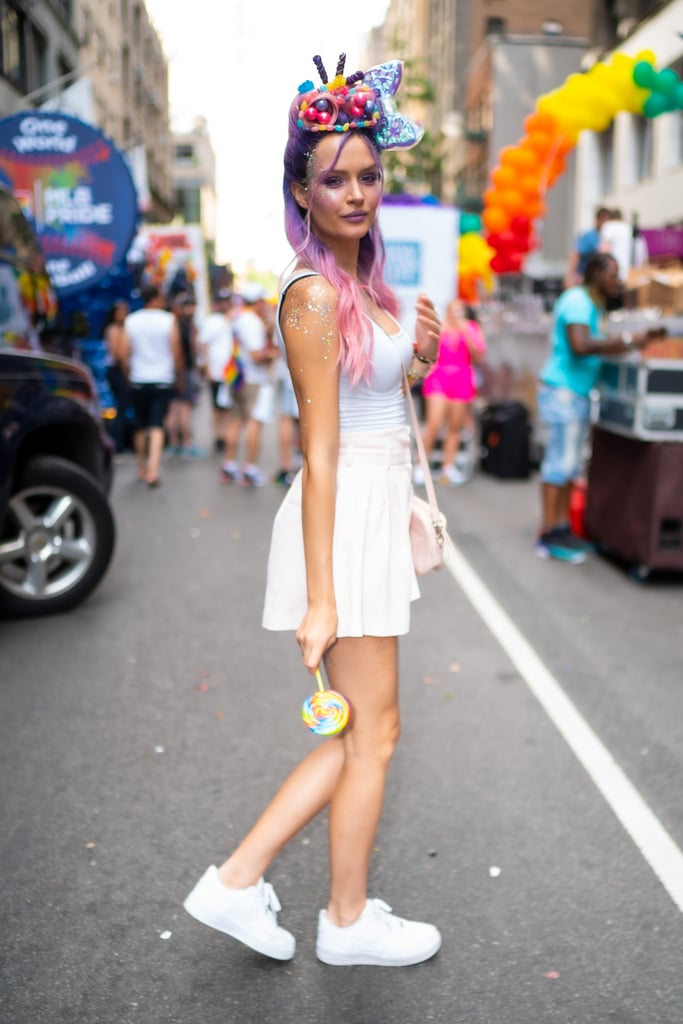 Josephine Skriver wearing a unicorn headpiece and pastels.