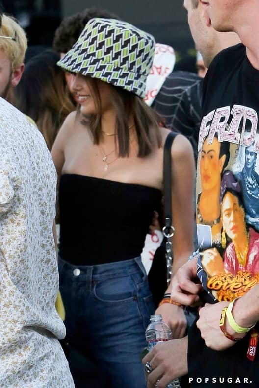 Kaia Gerber Jeans and Tube Top With Bucket Hat at Coachella