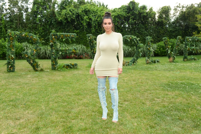 Kim Wore Her Denim Over-the-Knee Boots With a Sweater Dress While at a Revolve Event