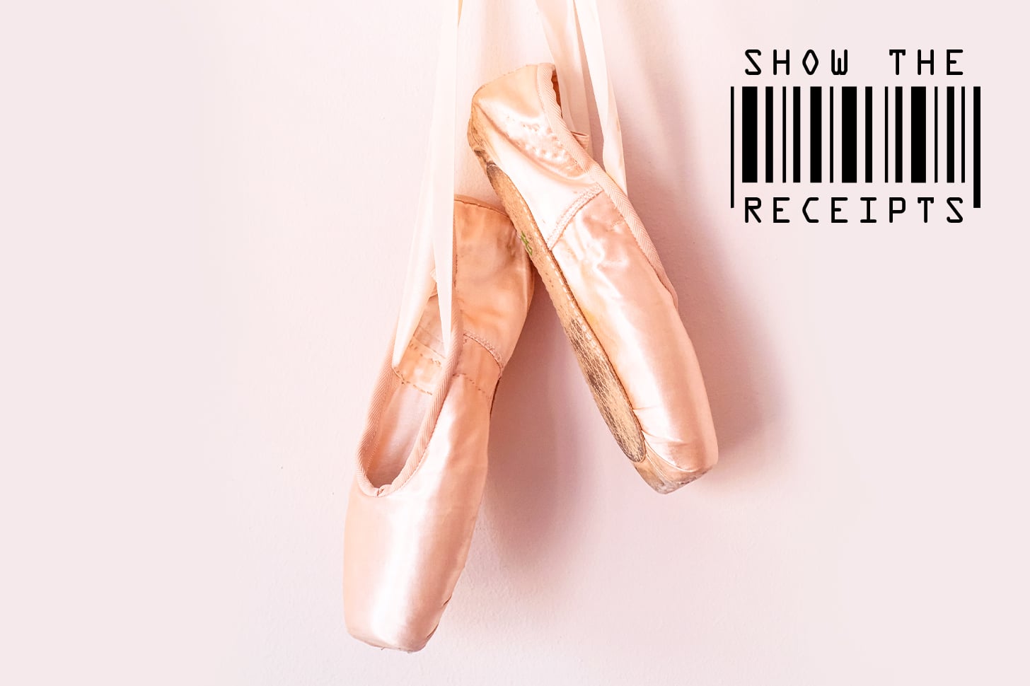 a pair of pink pointe shoes