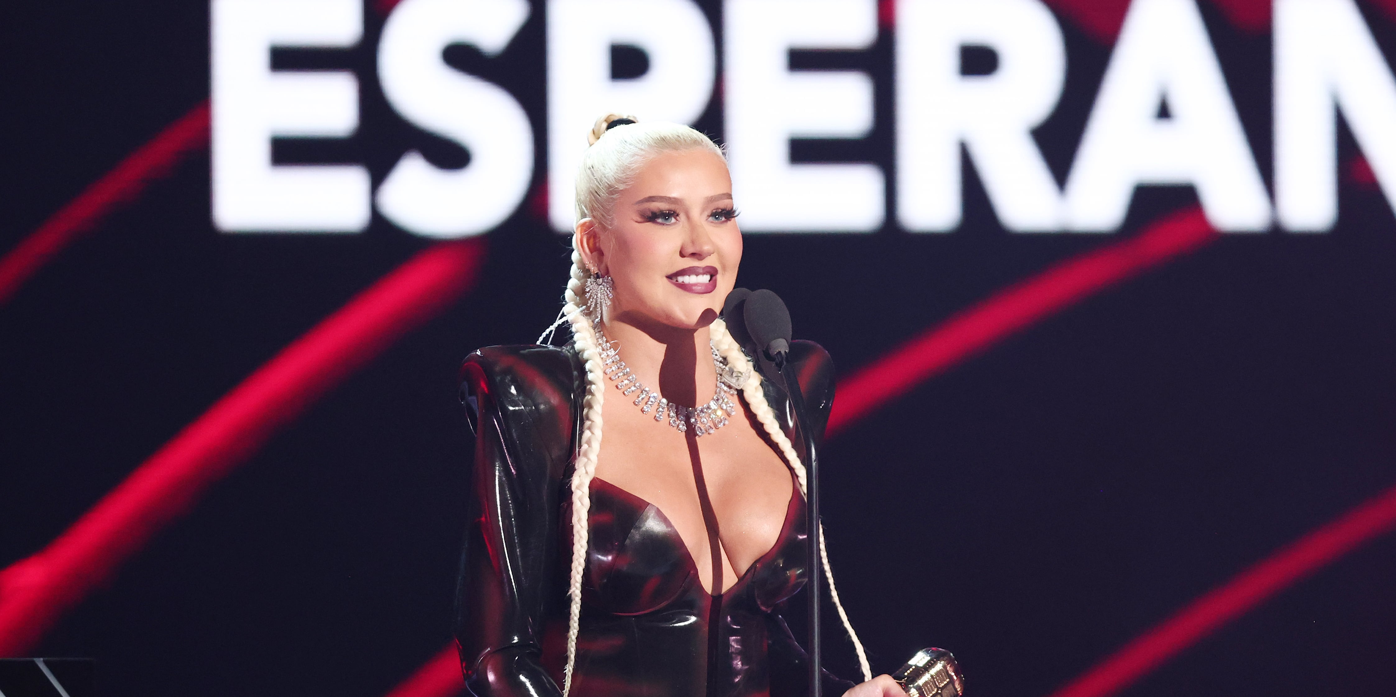 christina aguilera purple latex dress Christina Aguilera flaunts her curves in purple leather dress for  performance in Dubai