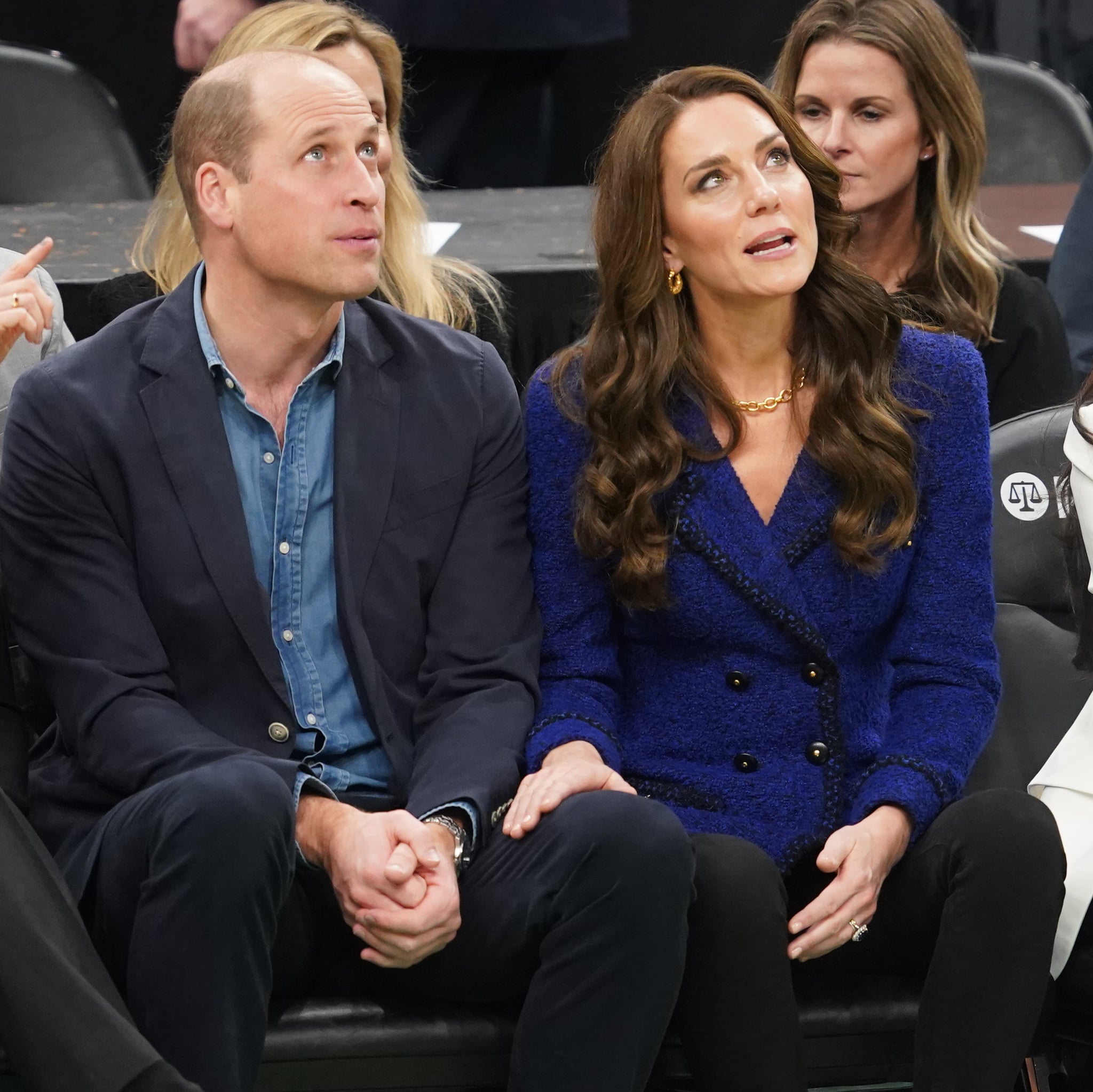 Prince William and Kate Middleton sitting courtside at an NBA game between the Boston Celtics and the Miami Heat.