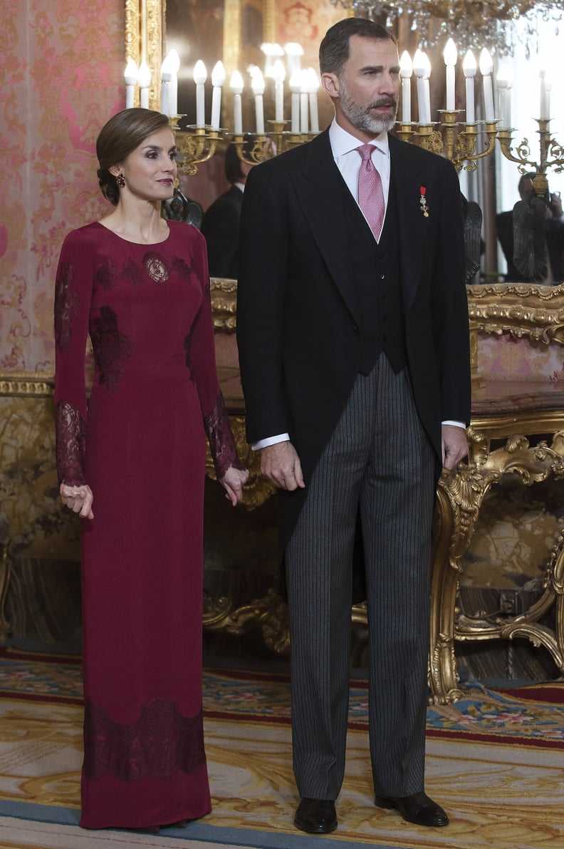 A Long-Sleeved Burgundy Gown With Lace Details From Felipe Varela