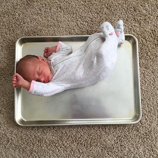 Baby vs. cookie sheet.