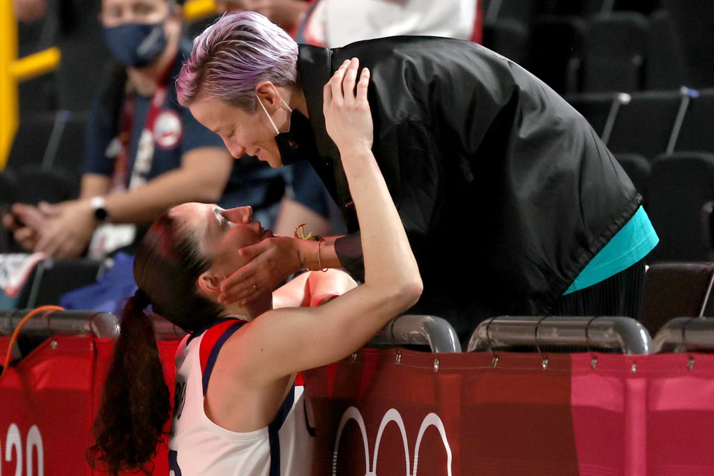 What's the best way to celebrate after winning a record fifth gold medal at the Olympics? If you ask Sue Bird, it might just be a kiss from fiancée Megan Rapinoe. On Aug. 8, after the US women's basketball team defeated host nation Japan 90-75, it didn't take long for Sue to find Megan in the crowd so they could experience the win together. "[I'm] honestly inspired, and it feels like corny to say, but it's like everything you would want in someone that you would look up to. Obviously, I get to be with her and I love her, that's the most special part," Megan told NBC. Later, she shared a photo of the pair's kiss along with the caption, "I am so proud of you @sbird10 ❤️. As if I could love you any more 🥰. Congrats baby!"
The couple first started dating in 2016, after meeting at a sponsored event for the Rio Olympics. "It was kinda like, 'OK, we both live in Seattle, we should be friends. Why aren't we friends?'" Megan previously told The Seattle Times. After dating for four years, Megan proposed in October 2020. You can see pictures of the power couple's adorable reunion ahead.

    Related:

            
            
                                    
                            

            These 5 Duos Are Taking "Power Couple" to New Heights at the Tokyo Olympics