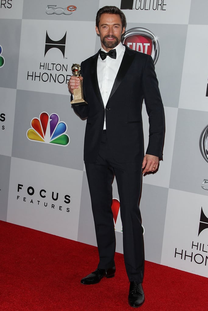 Hugh Jackman held up his Golden Globe.
Hugh Jackman held up his Golden Globe.