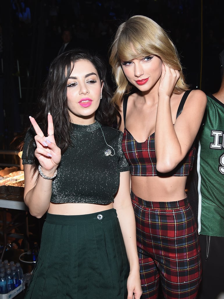 Prior to the bash, Taylor hung out with Charli XCX backstage at Z100's Jingle Ball concert.