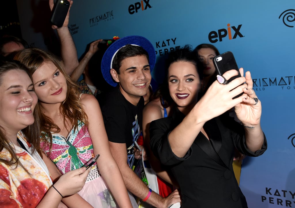 Katy Perry stopped to snap a selfie with fans at the Thursday night screening of Katy Perry: The Prismatic World Tour in LA.