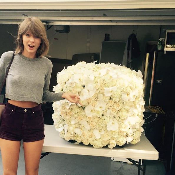 Taylor Swift and Kanye West proving that bad blood and VMA interruptions can be forgotten through flowers.