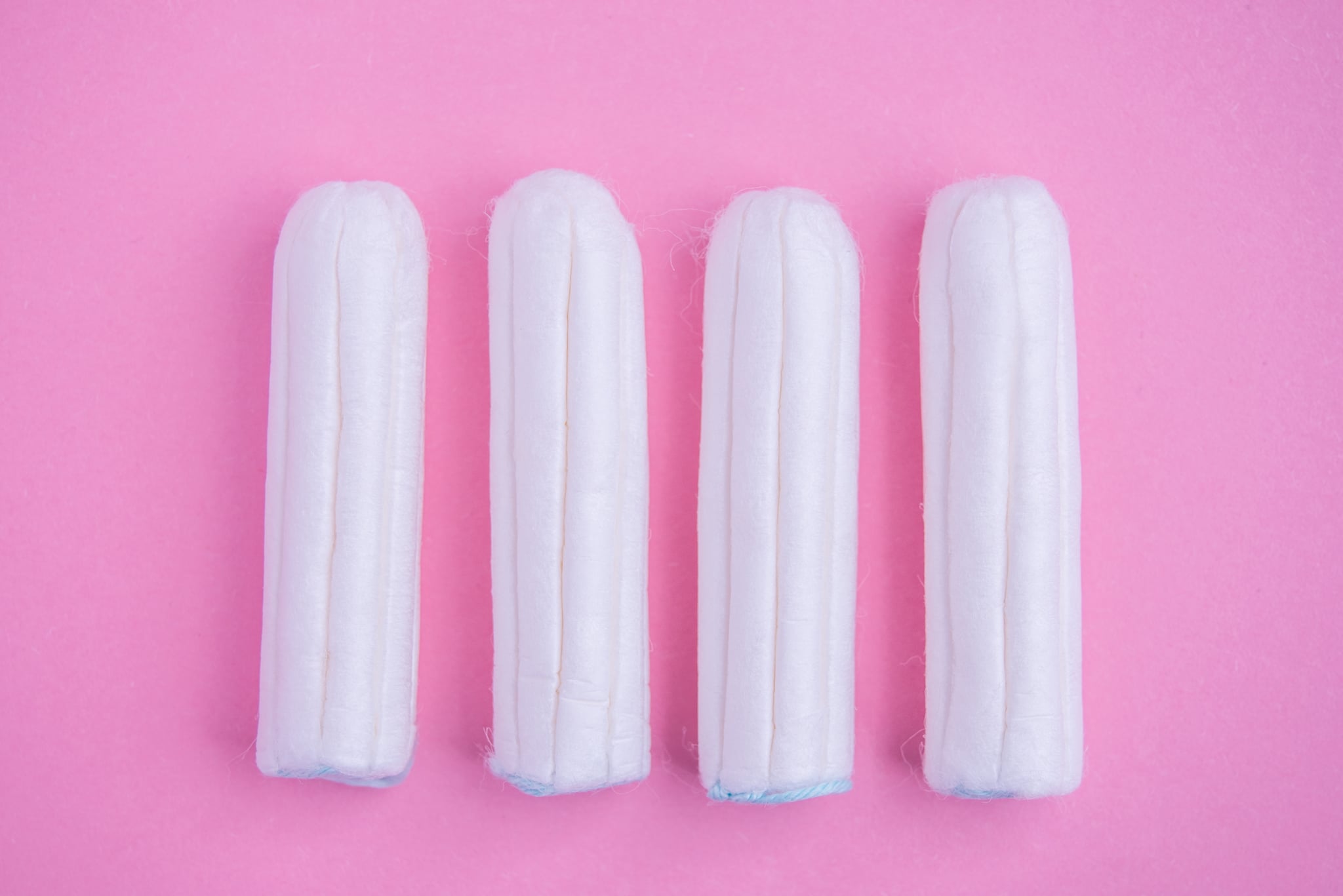 Tampons on pink background