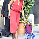 With an equally stylish Flynn in tow, Miranda glowed in a coral-hued A.L.C. dress.