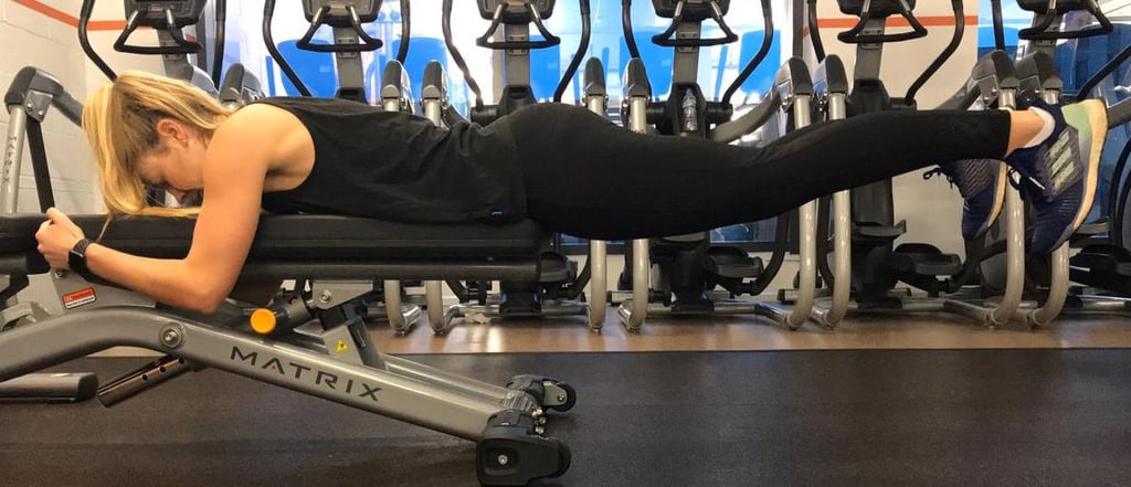 "The reverse hyper on bench exercise is great for glute and lower back coordination, as well as building endurance for pushing and sprinting," Woodhouse explains. "Ideally, you'd use a bench for this move. So, lay face down, with the edge of the bench in contact with your hip bones (so your legs are dangling over the edge of the bench). Secure your body against the bench [by holding on] with your hands and then push your legs up and back until they're parallel to the floor, squeezing your bum at the top. Don't raise your legs higher than parallel, and repeat this ten times – though don't worry if you can't quite manage this many repetitions when you first start out — you can build up to it over time."