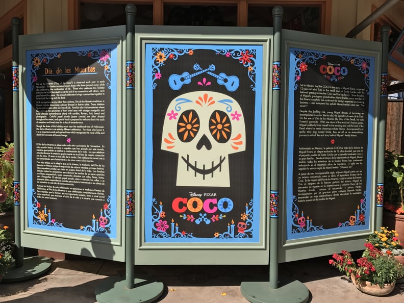 Outside a Coco exhibit, you can learn more about Día de los Muertos.