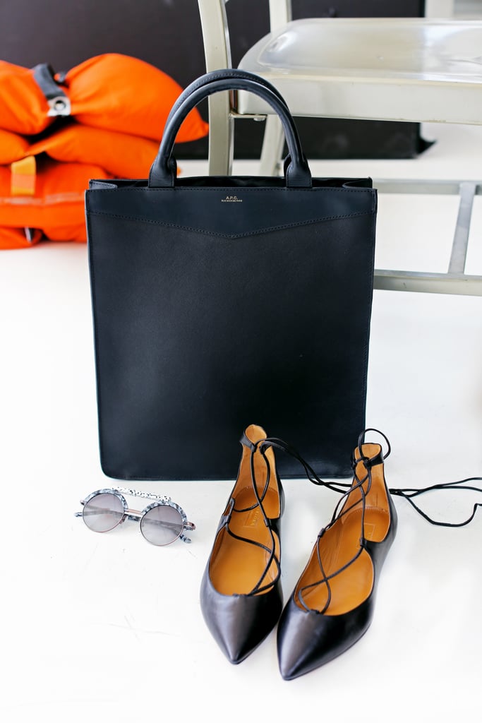 Tote It: In addition to your carryon luggage, make your personal item an oversize tote bag you can easily slide under the seat in front of you. Place anything you'll be asked to remove at security into the tote, so it's easily accessible — think toiletries, laptop, etc. 
Within the tote, pack a zippered clutch you can later use as a wallet or an evening bag. If you're bound for someplace tropical, the tote can also double as a beach bag.
Save Your Soles: Pack a pair of dancing shoes for going out and a pair of boots you can wear to a bar or a business meeting. The only other shoe you'll need is a comfortable sandal or flat which you can you can wear while you travel to save room in your suitcase.