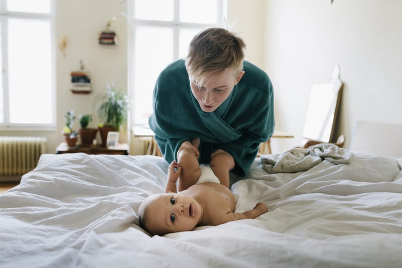 nonbinary parent with their baby