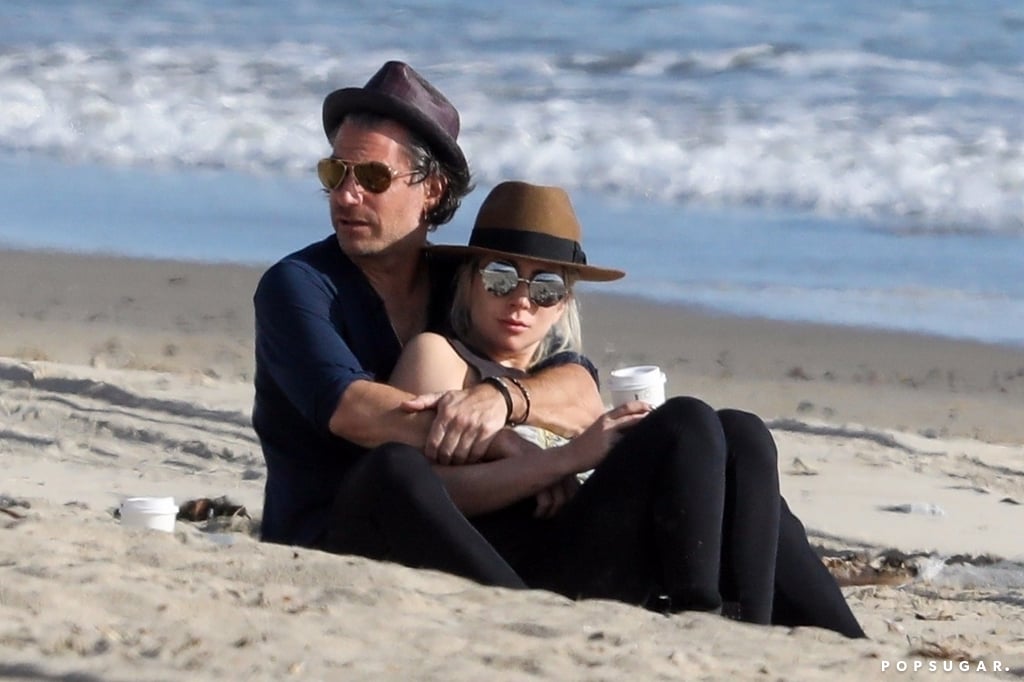 Lady Gaga and fiancé Christian Carino cuddled on the beach in March 2018.