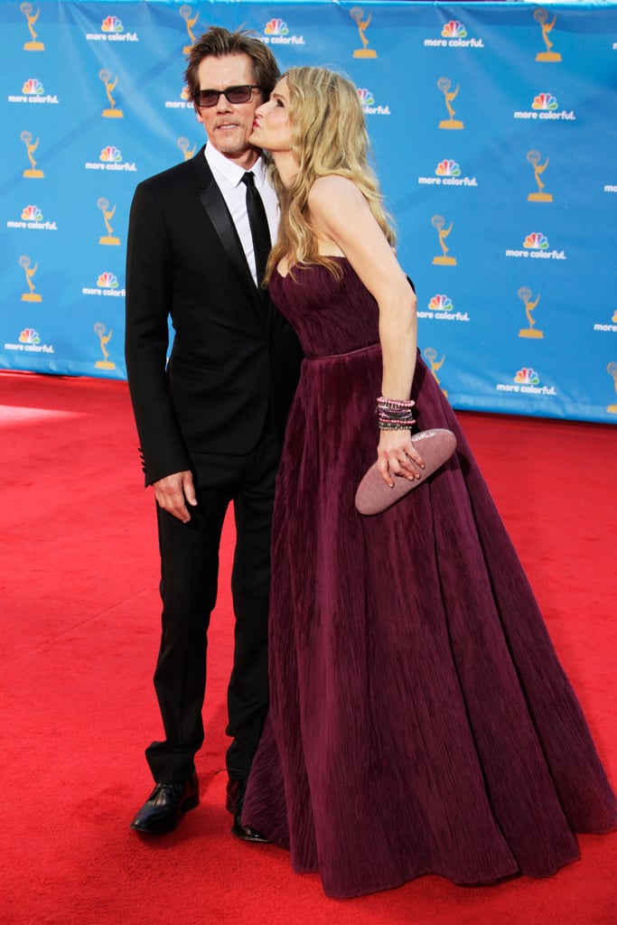 Kyra gave her husband a kiss on the cheek as they walked the red carpet at the Emmy Awards in August 2010.