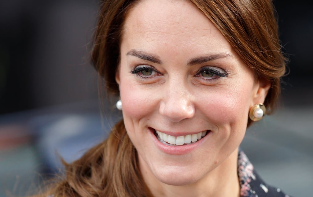 For a trip to Manchester, Kate chose $190 pearl and gold studs by Oscar de la Renta.