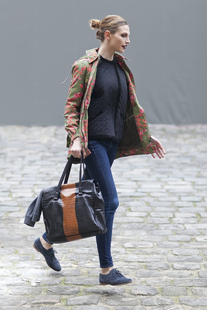 A floral print on this showgoer's anorak brightened up her head-to-toe style.
A floral print on this showgoer's anorak brightened up her head-to-toe style.