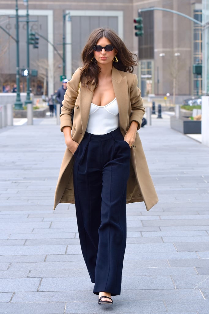 Play right into classic vibe with a camel coat and understated top like Emily Ratajkowski.