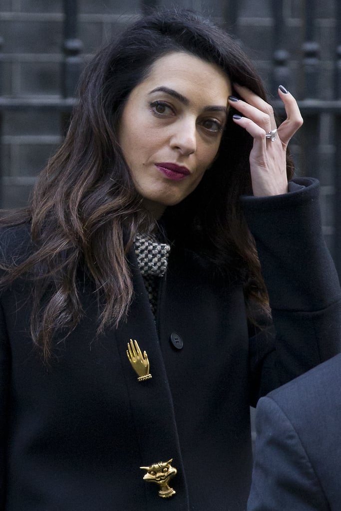 Amal Clooney Wearing a Black Coat With Gold Buttons