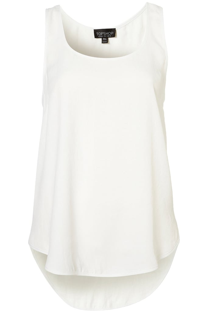 This is the quintessential sporty white tank top. Beach Fashion