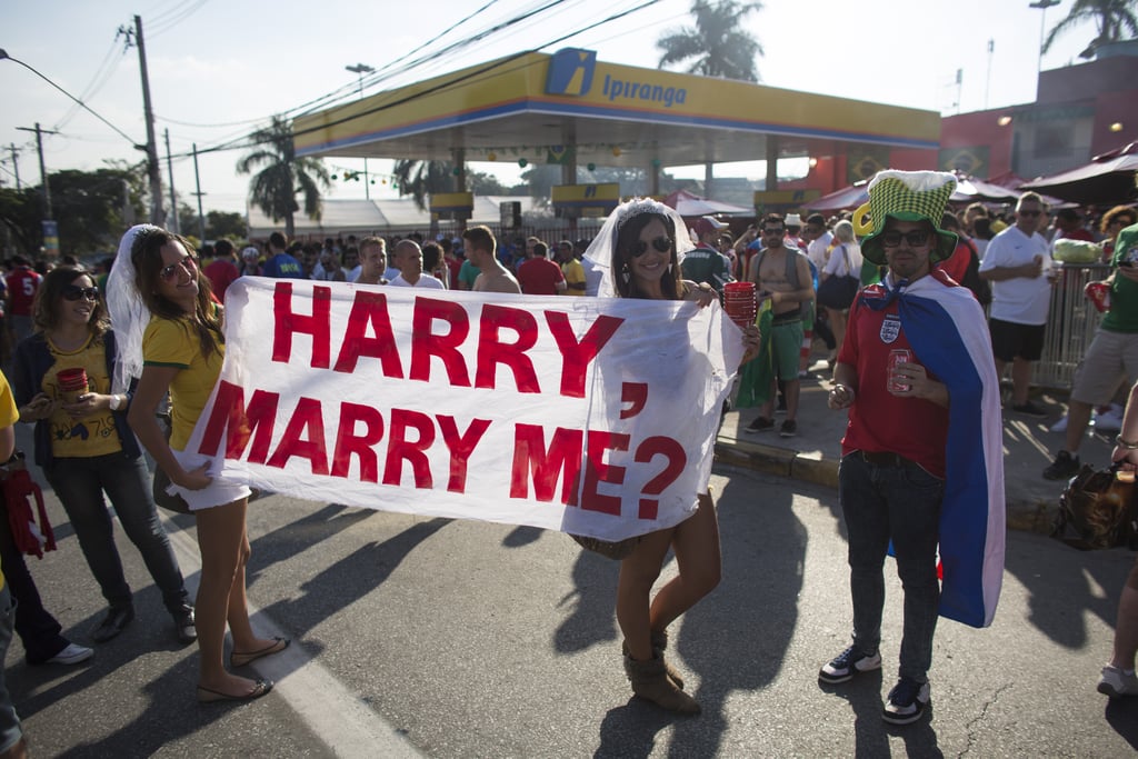 These fans in Brazil went one step further by wearing veils to go along with their marriage proposal.