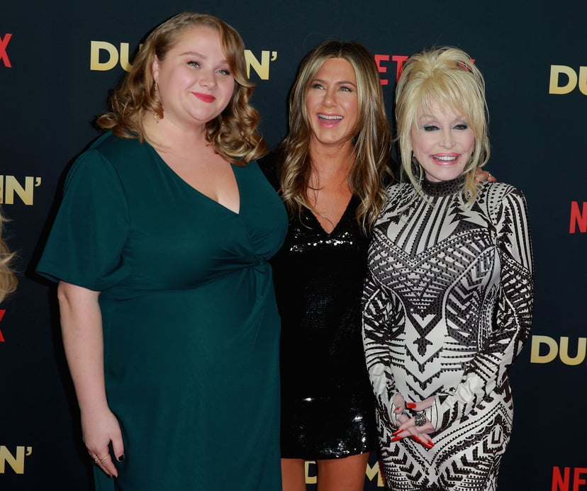 HOLLYWOOD, CA - DECEMBER 06:  Actors Danielle Macdonald and Jennifer Aniston and singer Dolly Parton attend the premiere of Netflix's 