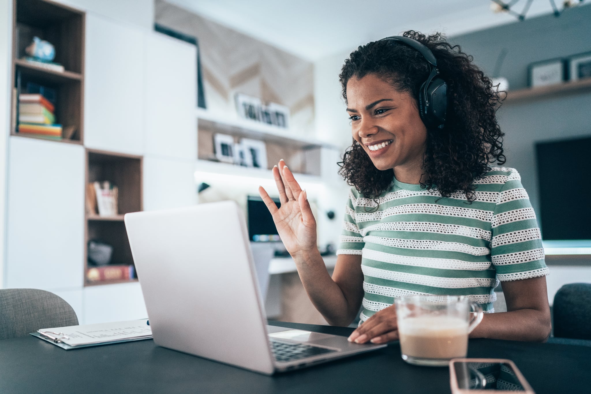 Young modern woman having Video Conference at home