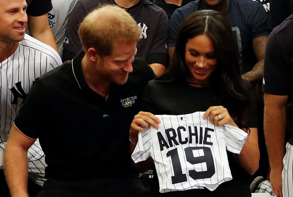 We knew Prince Harry would be at the first-ever Major League Baseball game in London, but it turns out Meghan Markle came along, too! On Saturday, the sweet royal couple attended the game between the New York Yankees and the Boston Red Sox at Queen Elizabeth Olympic Park. The prince — who sported a t-shirt with jeans — and the duchess — who rocked a sophisticated black dress — visited both teams in their respective locker rooms to greet the staff and players (and Meghan's distant relative, Red Sox player Mookie Betts). 
While meeting with the organizations, Harry and Meghan even received a few special gifts for their newborn son Archie Harrison Mountbatten-Windsor: a tiny Yankees jersey and a Red Sox onesie! "You guys have beaten next door's present, by the way," Harry told the Yankees team upon receiving the jersey.
There’s video too! How cool is this! #royals #yankees #redsox #princehaery #meghamarkle pic.twitter.com/csihthSR81— Meredith Marakovits (@M_Marakovits) June 29, 2019



Their visit is reminiscent of Prince Harry throwing out the first pitch at a New York Mets game in 2010. He didn't get to show off his throwing arm this time around, but he seemed to enjoy the sporting event alongside Meghan, leaving us with soaring hearts and cheesy smiles. Keep scrolling to see more pictures and videos from their appearance!

    Related:

            
            
                                    
                            

            Harry "Can&apos;t Wait" to Introduce Meghan and Archie to South Africa — Get All the Details!