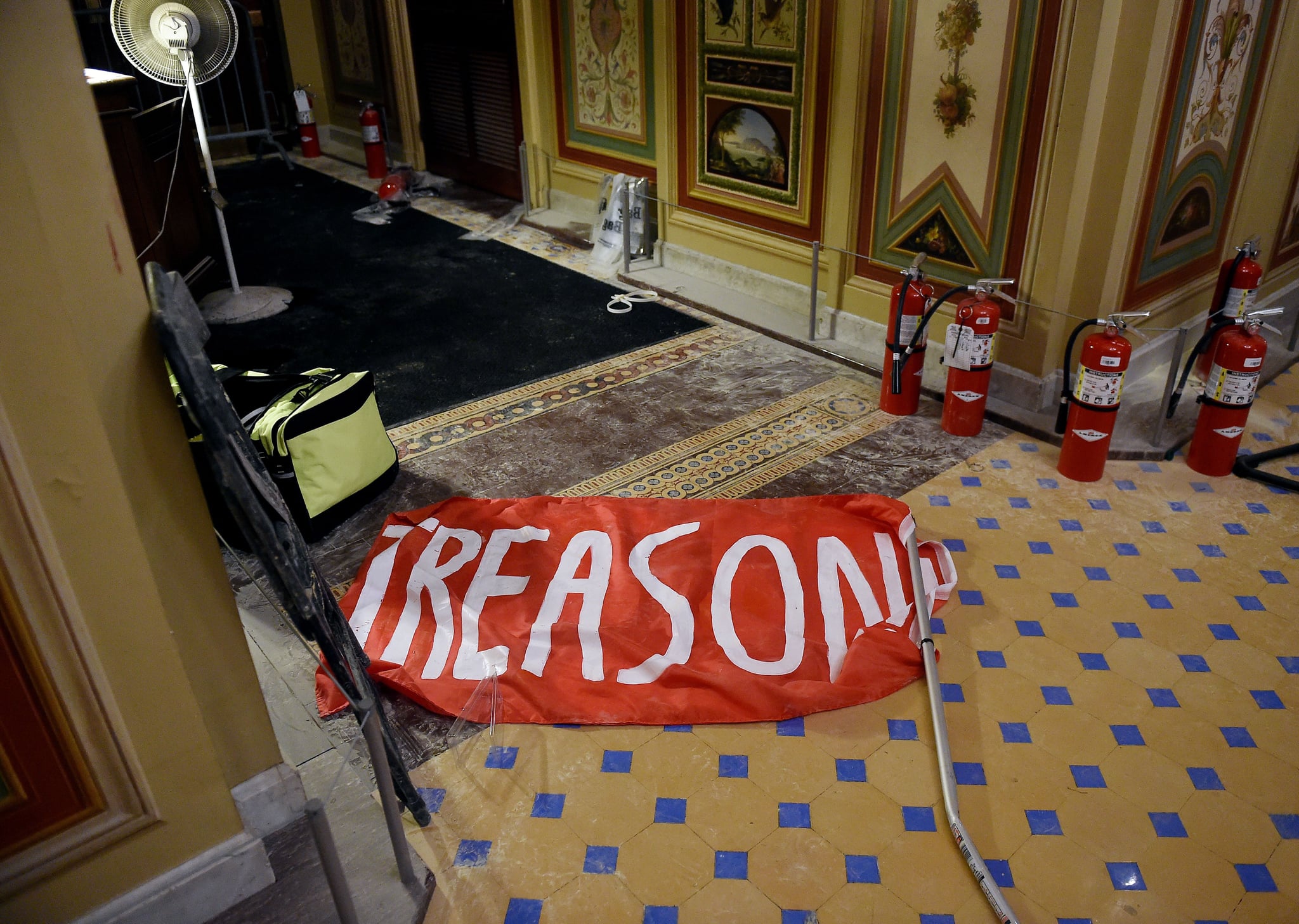 Damage is seen inside the US Capitol building early on January 7, 2021 in Washington, DC, after supporters of US President Donald Trump breeched security and entered the building during a session of Congress. - Donald Trump's supporters stormed a session of Congress held today, January 6, to certify Joe Biden's election win, triggering unprecedented chaos and violence at the heart of American democracy and accusations the president was attempting a coup. (Photo by Olivier DOULIERY / AFP) (Photo by OLIVIER DOULIERY/AFP via Getty Images)