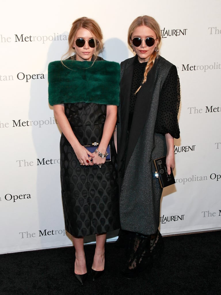 Twinning combo: So bright, they've gotta wear shades. Ashley and Mary-Kate accessorized their March 2011 Metropolitan Opera looks with matching oversize round sunglasses.

Ashley kept cozy in an emerald-green fur stole over her jacquard sheath dress.
Mary-Kate topped her sheer, polka-dot maxi dress with a metallic shawl-collar coat.