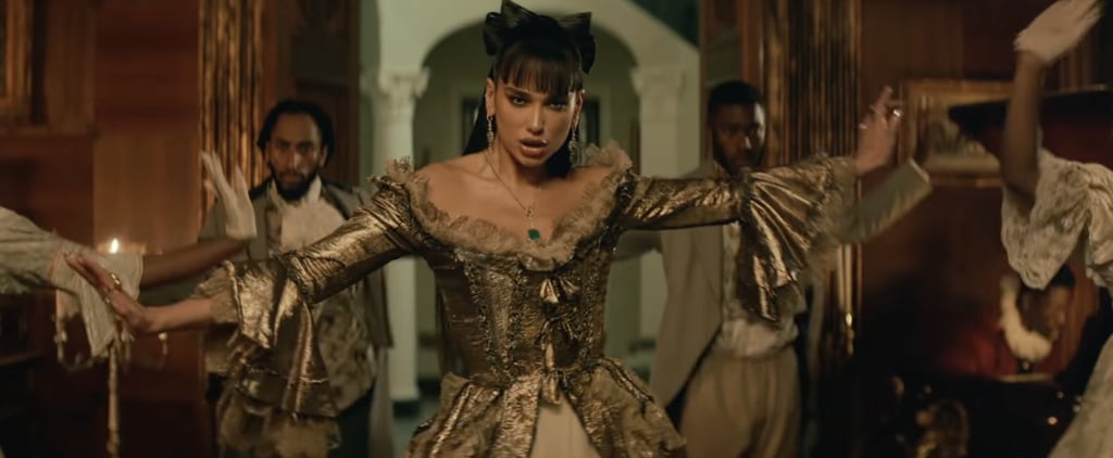 Dua Lipa Wears Gold Jean Paul Gaultier Corset in "Demeanor"