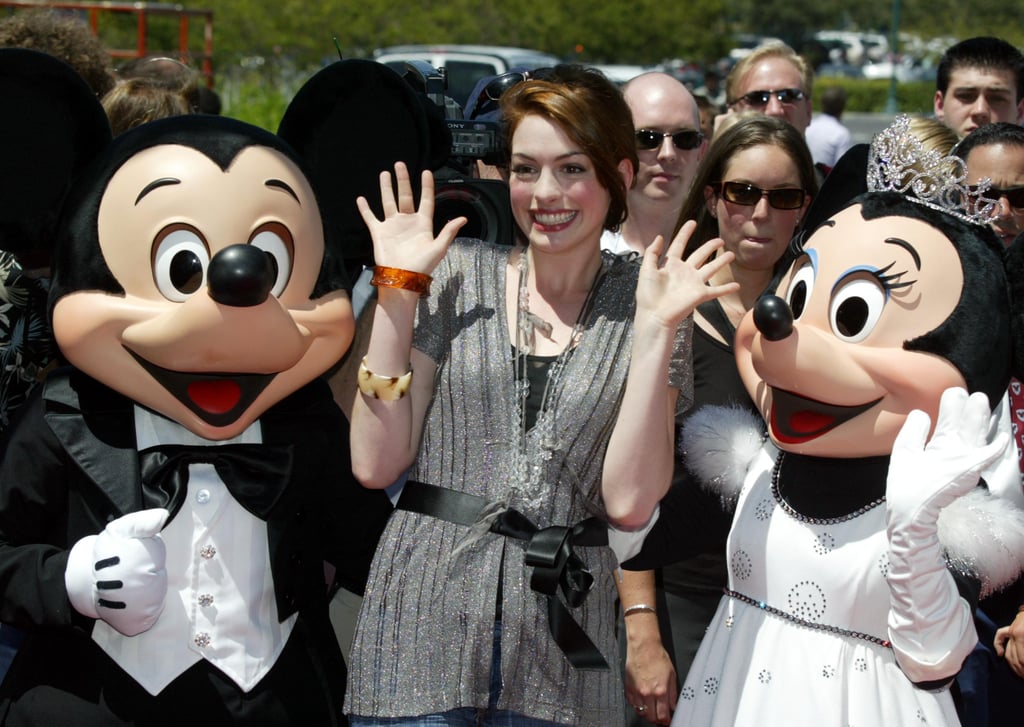 Anne Hathaway got together with Mickey and Minnie in August 2004.