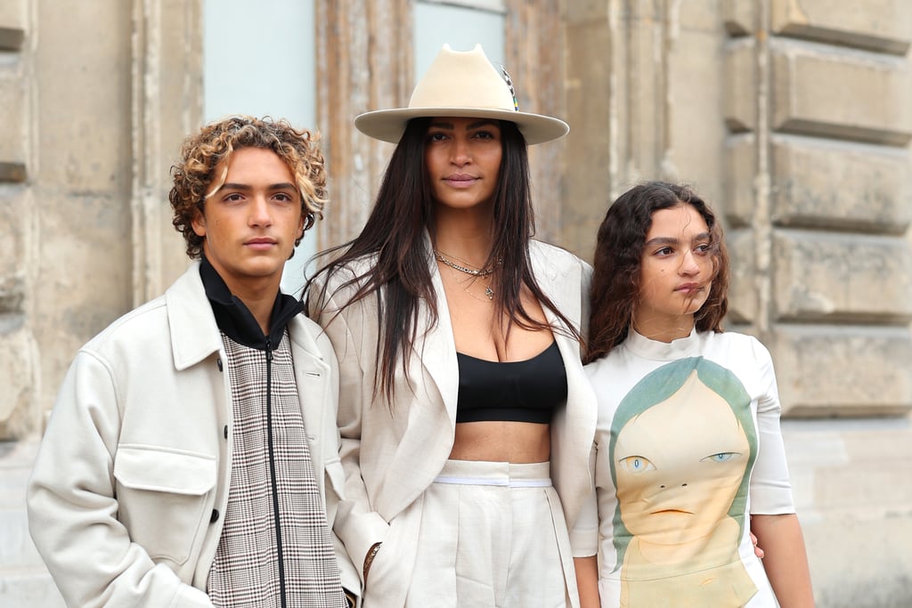 Who knew Matthew McConaughey and Camila Alves had such stylish kids? On March 6, the model brought their son and daughter, 14-year-old Levi and 13-year-old Vida, to Paris Fashion Week, where the chic trio attended Stella McCartney's fall 2023 runway show. 
Alves dressed in a linen suit, bra top, and fedora hat, while her children were the spitting image of their mom in complementary ivory-colored outfits. Levi wore a plaid tracksuit, jacket, and sneakers, and Vida looked beautiful in an artistic dress and short Ugg boots. McConaughey and the couple's younger son, 10-year-old Livingston, were not in attendance. The rest of the family enjoyed the show from the front row, among stars including Avril Lavigne, Noah Cyrus, and Jessica Alba. 
The kids have certainly grown up since they were last photographed at the 2019 Texas Medal of Arts Awards, where McConaughey was honored for his achievements in the entertainment industry and his non-profit foundation. At the time, the family of five posed for the cameras alongside McConaughey's mom, Kay. 
Though it's rare the McConaugheys make a public appearance together, the couple offers glimpses into their family life every now and then. The actor recently shared a photo of son Levi's bandaged back after a surfing adventure. "Surf souvenirs," he captioned the post. 
Ahead, check out more photos of the family's Paris Fashion Week outing. 

    Related:

            
            
                                    
                            

            Kate Hudson and Matthew McConaughey Reunite and Reflect on Their Kissing Chemistry