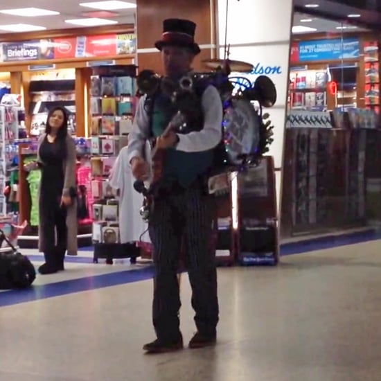 One-Man Band Singing Jingle Bell Rock at Airport